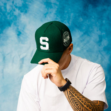 Michigan State Spartans Green Wool Snapback Hat with Block S Logo and University Seal Patch - On Model Lifestyle