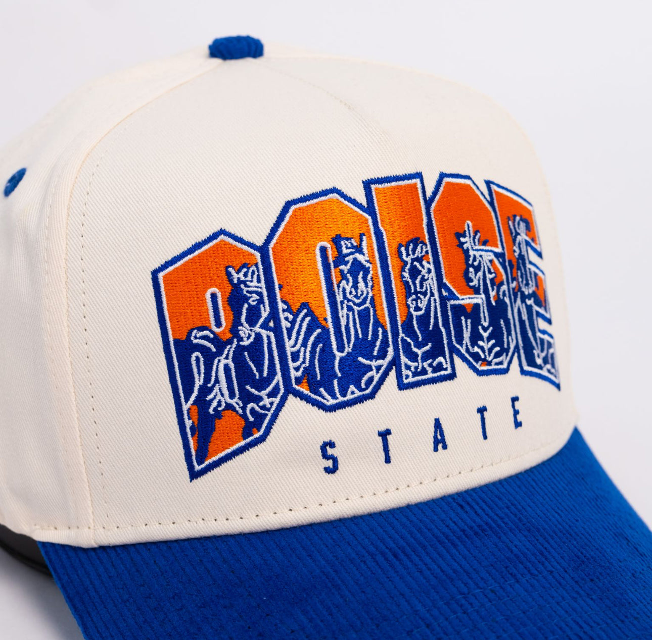 Boise State Broncos Cream and Blue Snapback Hat with Stampede Logo and The Blue Patch - Front Detail