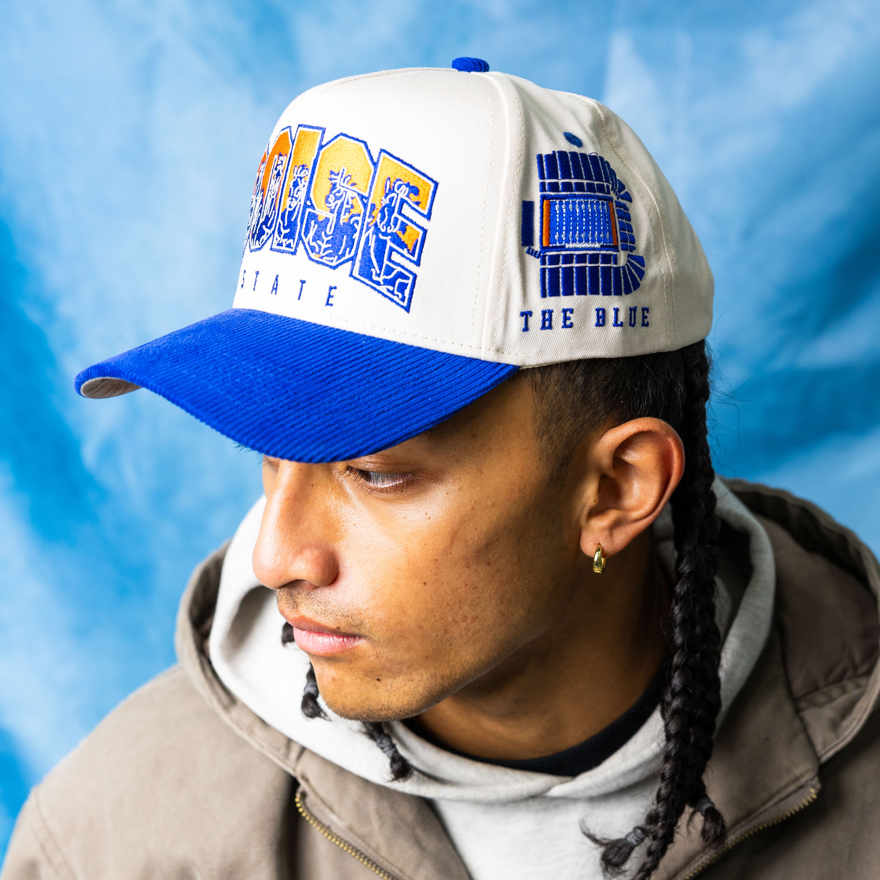 Boise State Broncos Cream and Blue Snapback Hat with Stampede Logo and The Blue Patch - On Model Lifestyle
