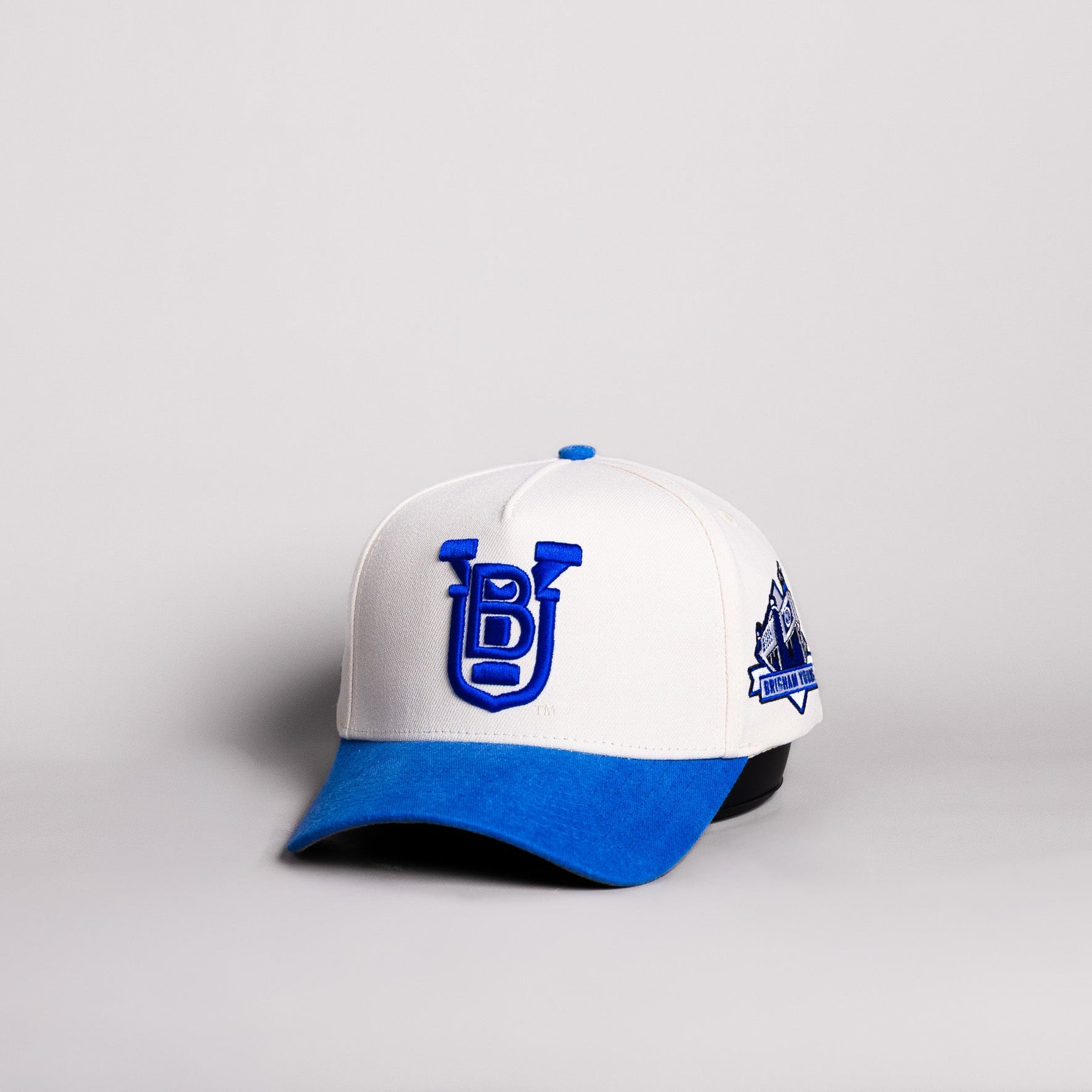BYU Cougars UB Monogram Hat Cream Cotton Royal Blue Suede Brim Brigham Young Patch Snapback - Angled View