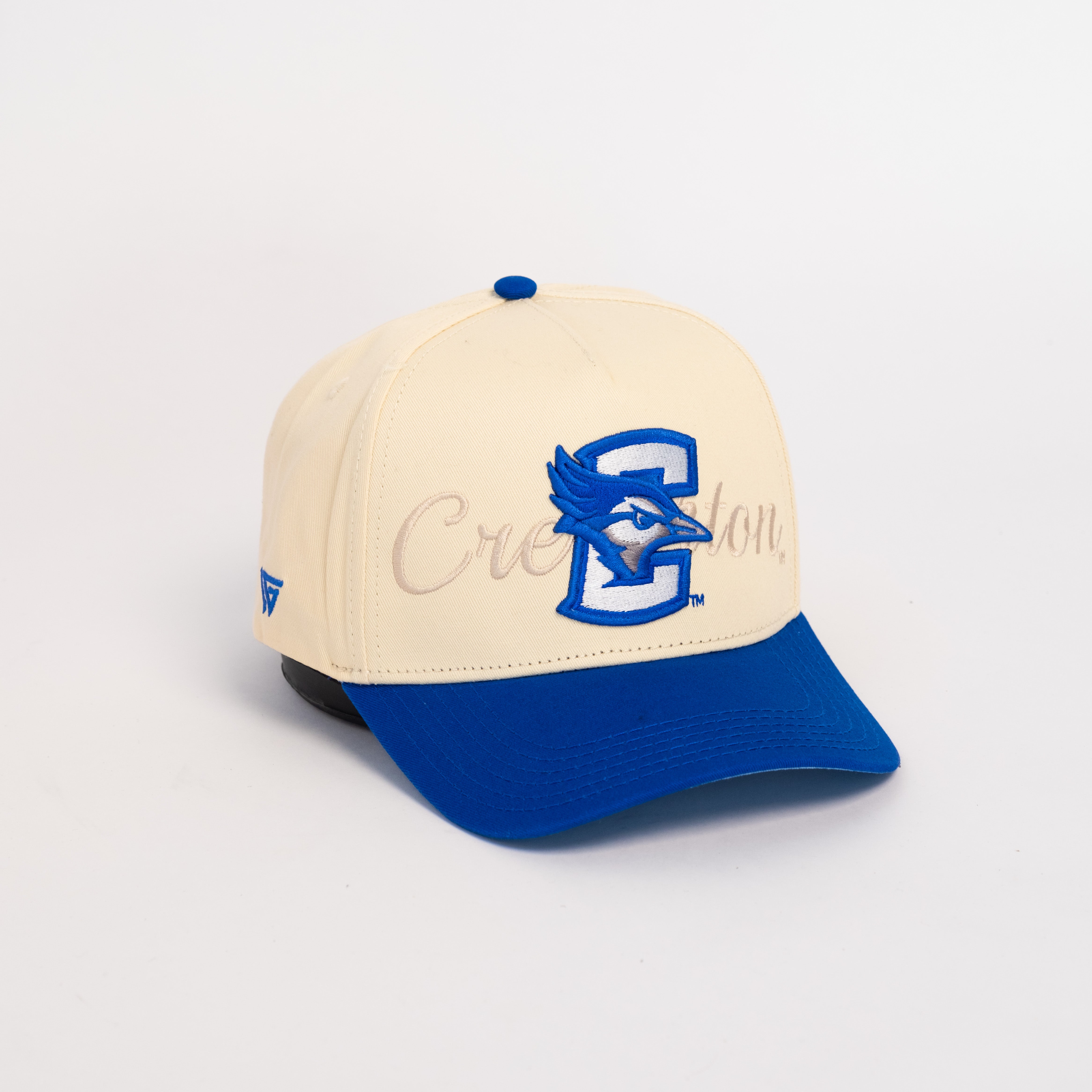 Creighton Bluejays Hat Cream and Royal Blue Snapback - Front Panel Angled