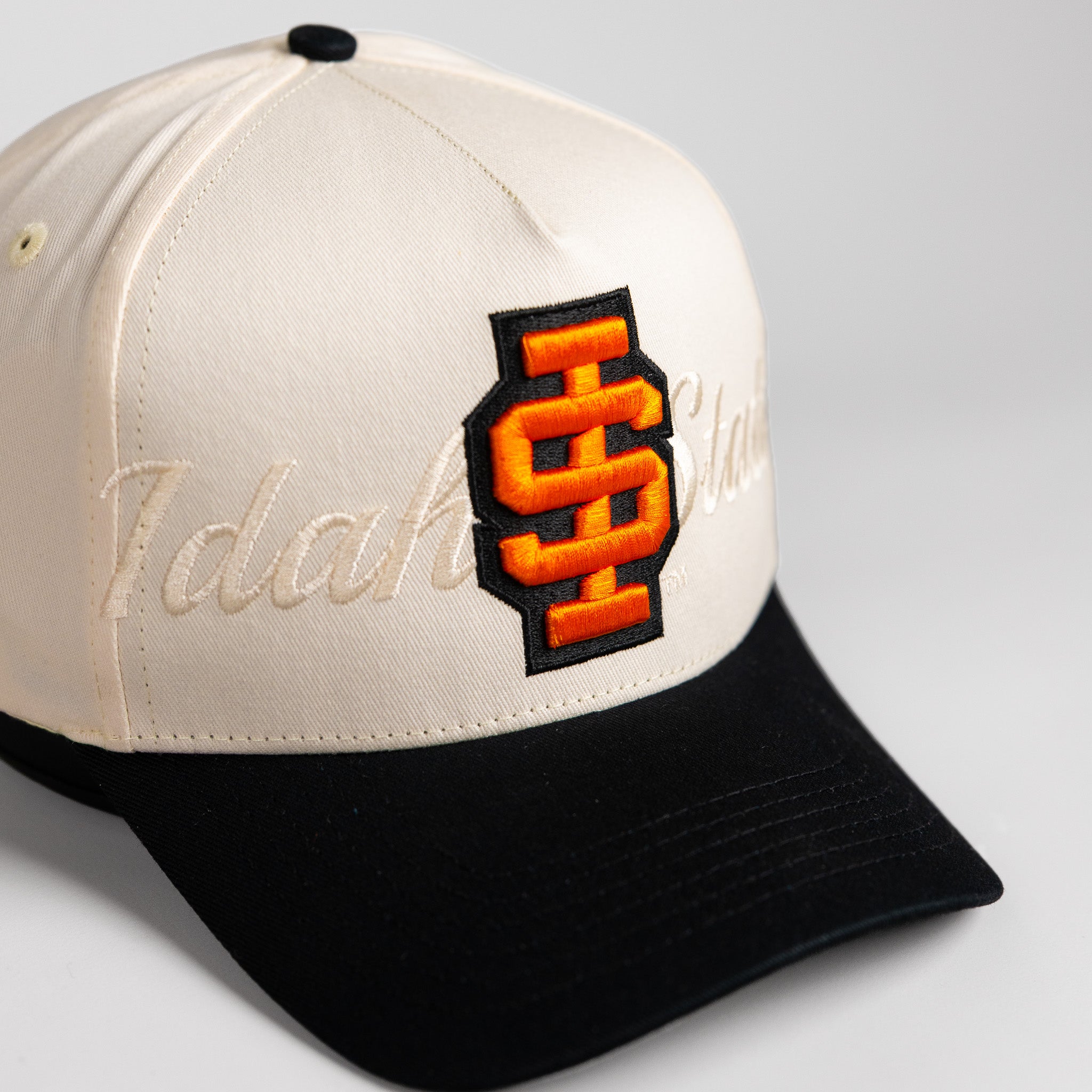 Idaho State Bengals Hat Cream & Black Stacked Script Snapback - Angled View