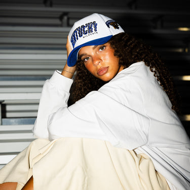 Kentucky Wildcats Hat White & Royal Blue Corduroy Stadium Pulse Snapback - On Model Seated Lifestyle