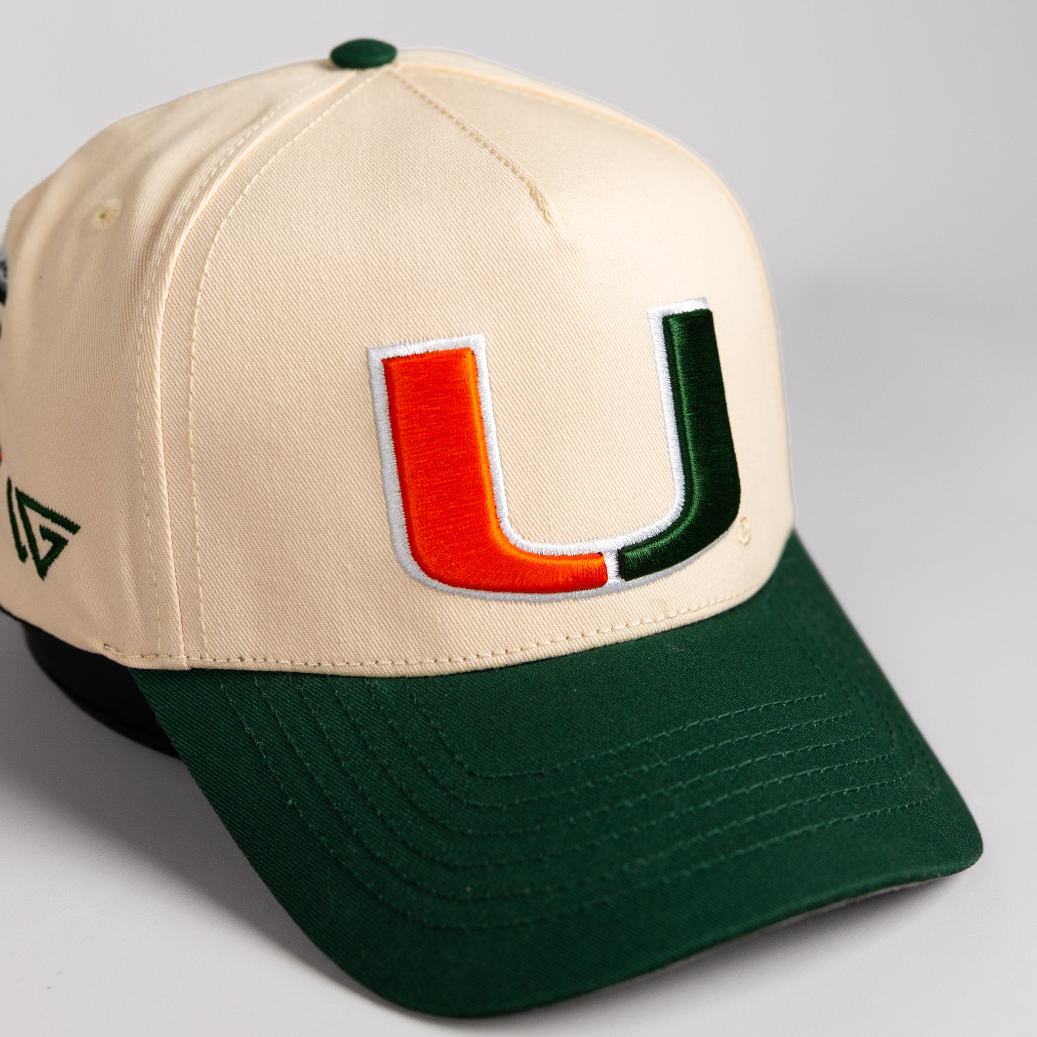 Miami Hurricanes Hat Cream & Green Full Stadium Snapback - Angled View