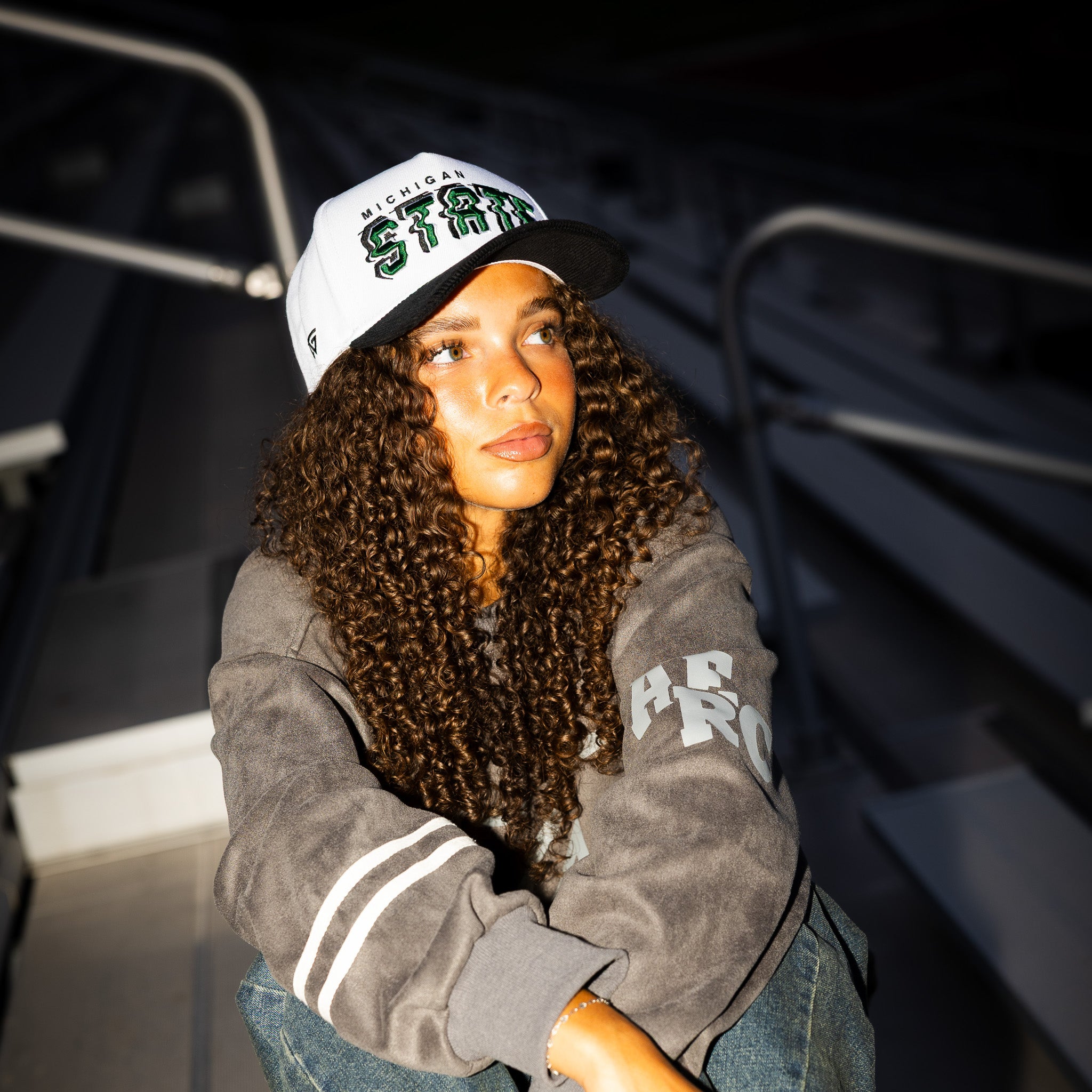 Michigan State Spartans Hat White & Black Corduroy Stadium Pulse Snapback - On Model Seated Lifestyle
