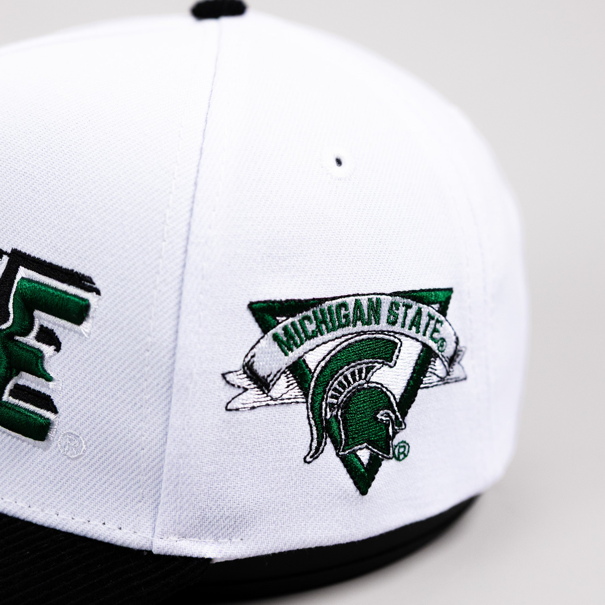 Michigan State Spartans Hat White & Black Corduroy Stadium Pulse Snapback - Side Spartan Patch Detail