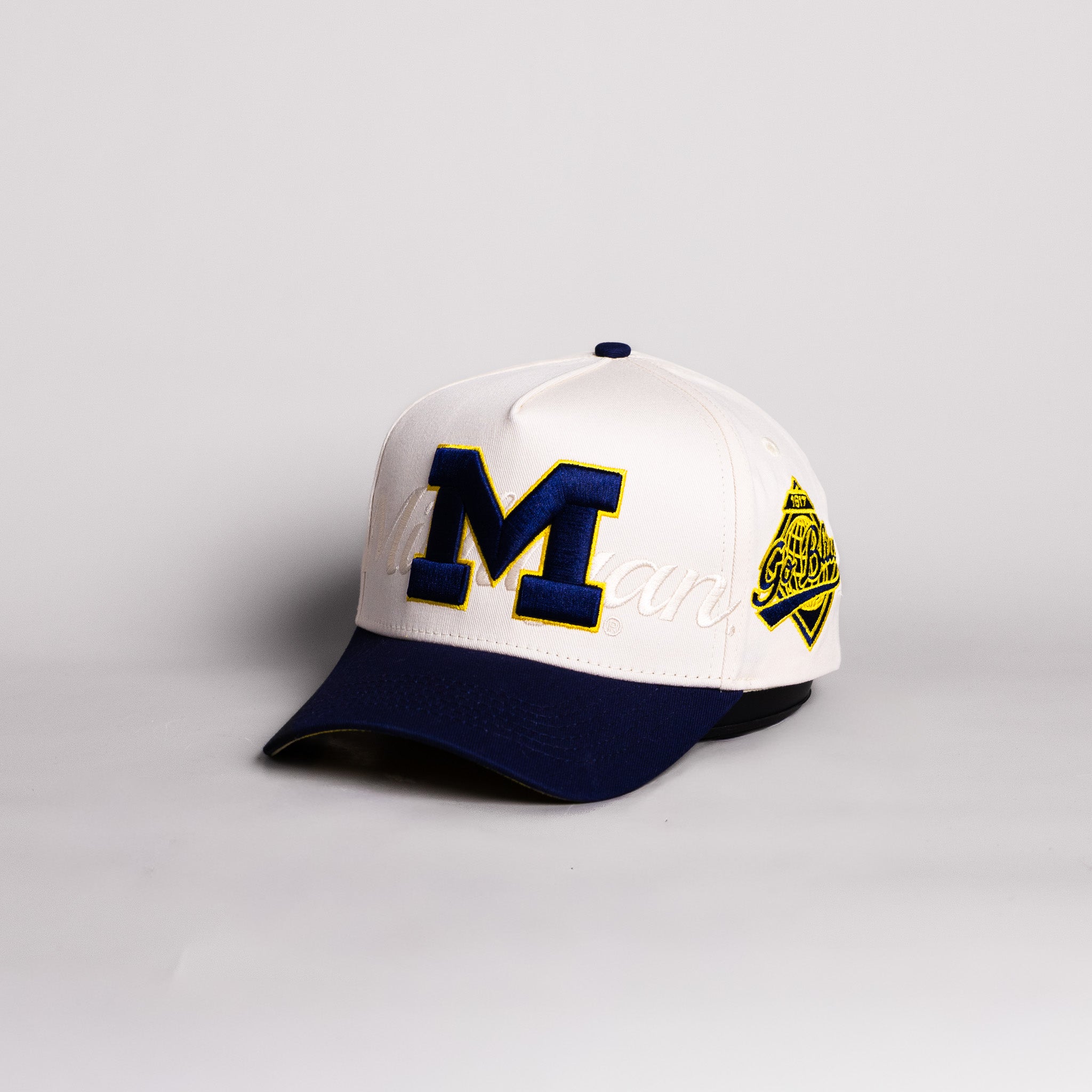 Michigan Wolverines Block M Hat Cream Cotton Navy Brim Go Blue Patch Snapback - Angled View
