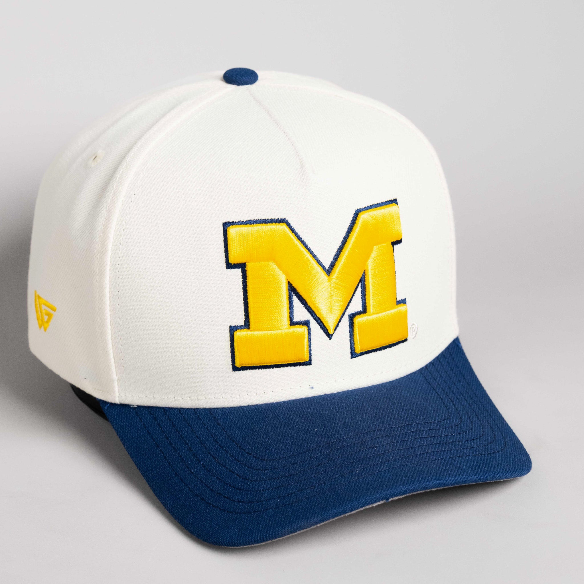Michigan Wolverines Hat Cream & Navy Banners Snapback - Angled View
