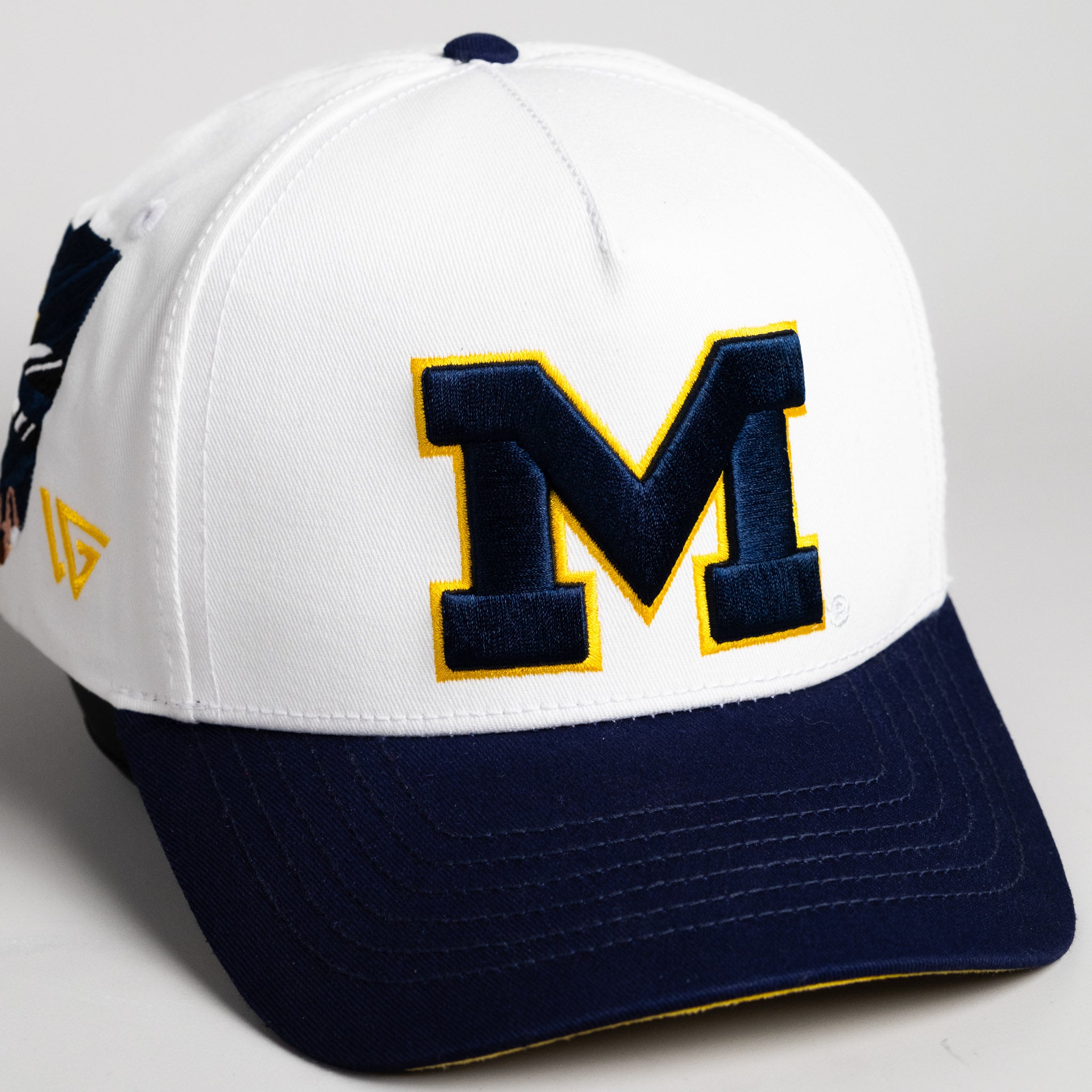 Michigan Wolverines Hat Cream & Navy Big House Full Stadium - Angled View