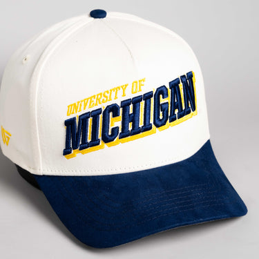 Michigan Wolverines Hat Cream & Navy Blue Tilt Snapback - Angled View