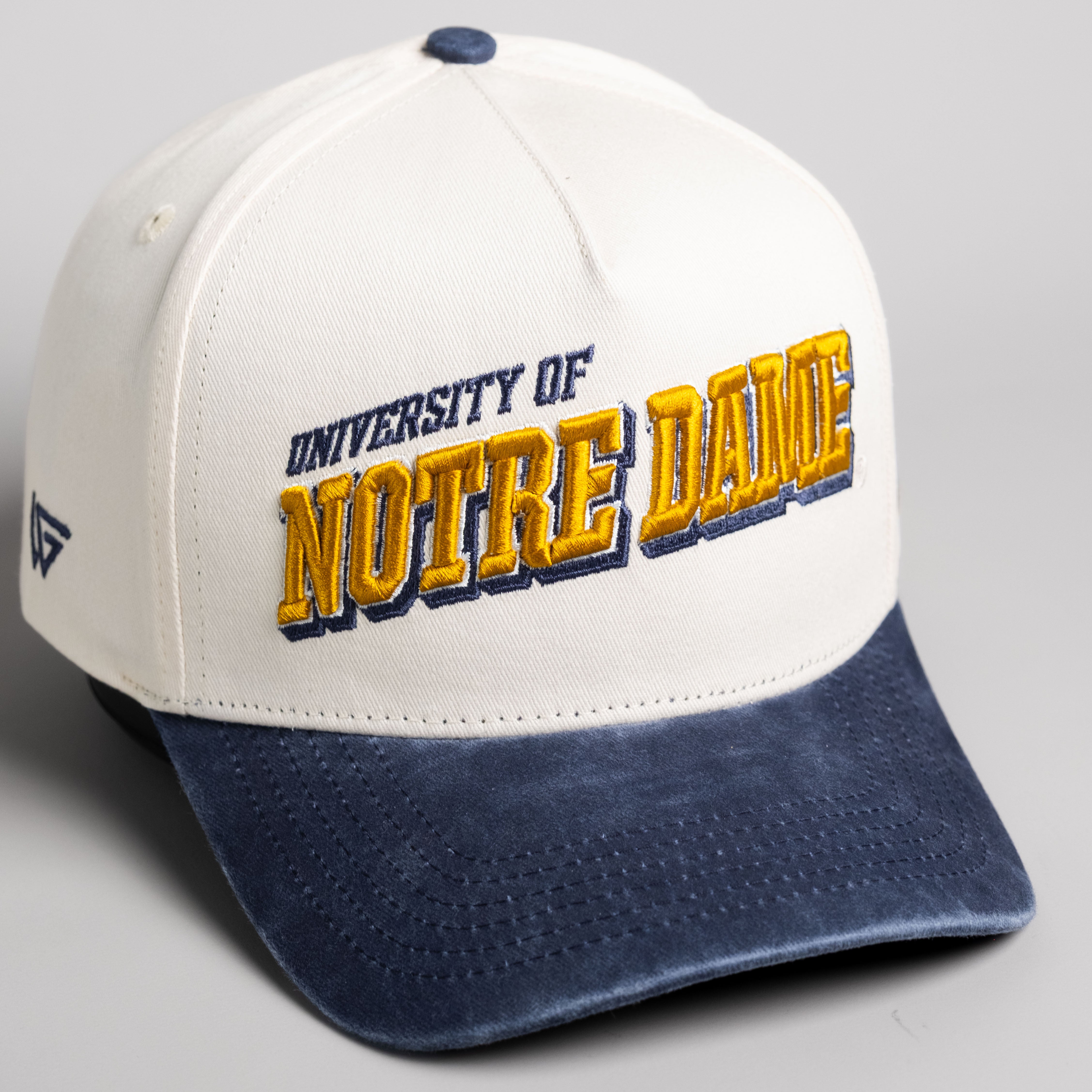 Notre Dame Fighting Irish Hat Cream & Navy Sun Fade Snapback - Angled View
