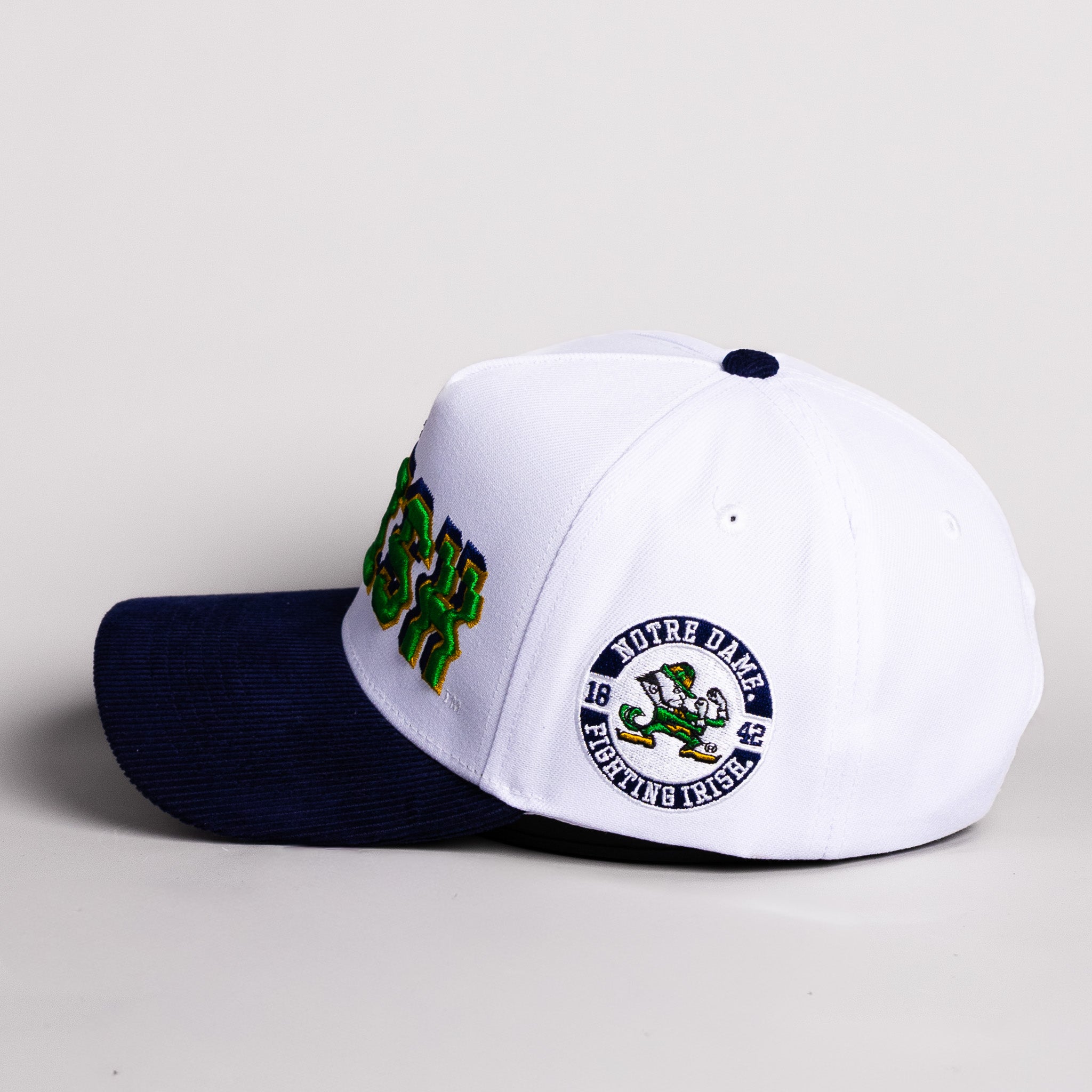 Notre Dame Fighting Irish Hat White & Navy Corduroy Stadium Pulse Snapback - Side Leprechaun Patch