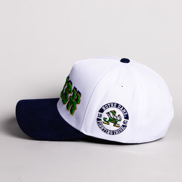 Notre Dame Fighting Irish Hat White & Navy Corduroy Stadium Pulse Snapback - Side Leprechaun Patch