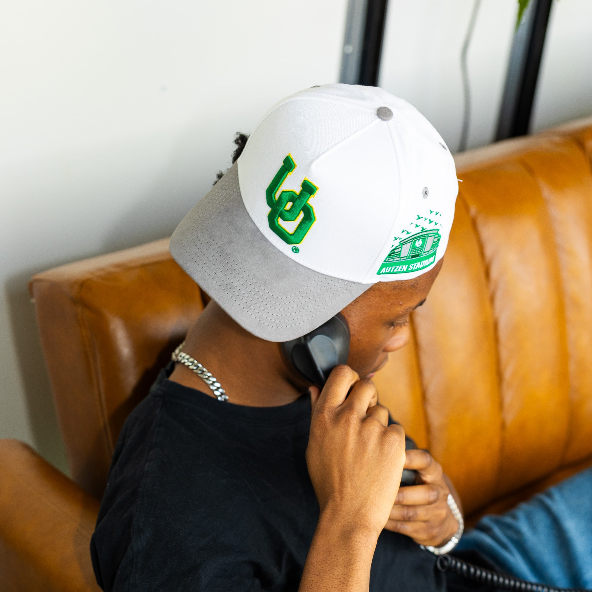 Oregon Ducks UO Hat White Grey Suede Brim Autzen Stadium Patch Snapback - On Model Seated
