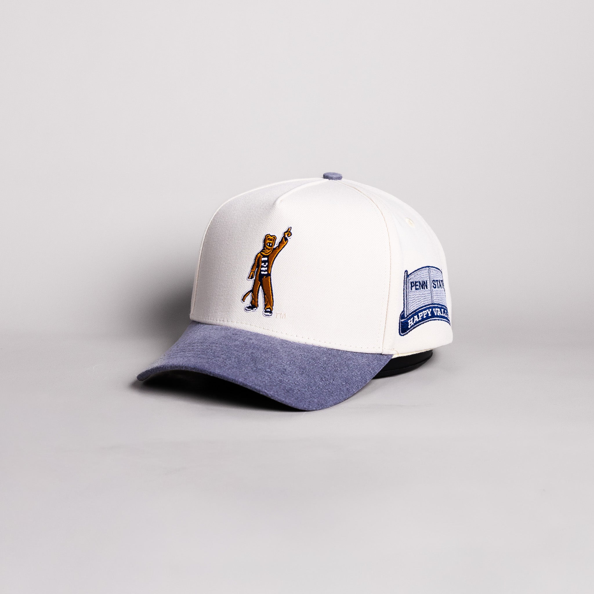 Penn State Nittany Lion Mascot Hat Cream Cotton Navy Suede Brim Happy Valley Patch Snapback - Angled View