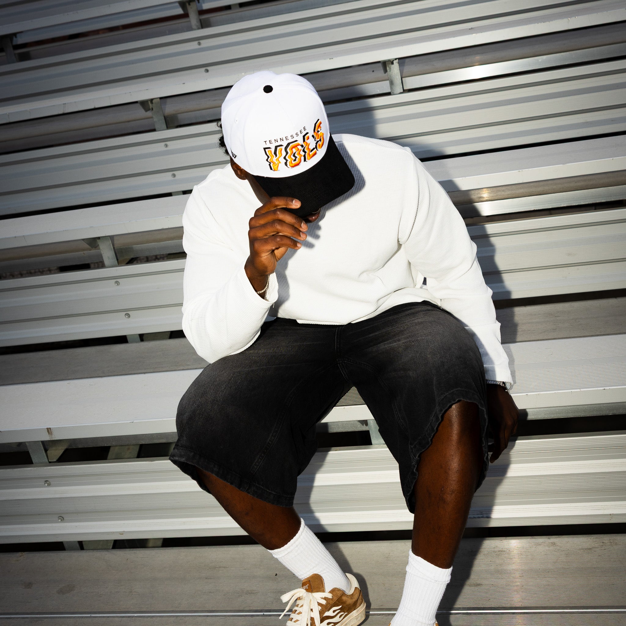 Tennessee Volunteers Hat White & Black Corduroy Stadium Pulse Snapback - On Model Seated Lifestyle