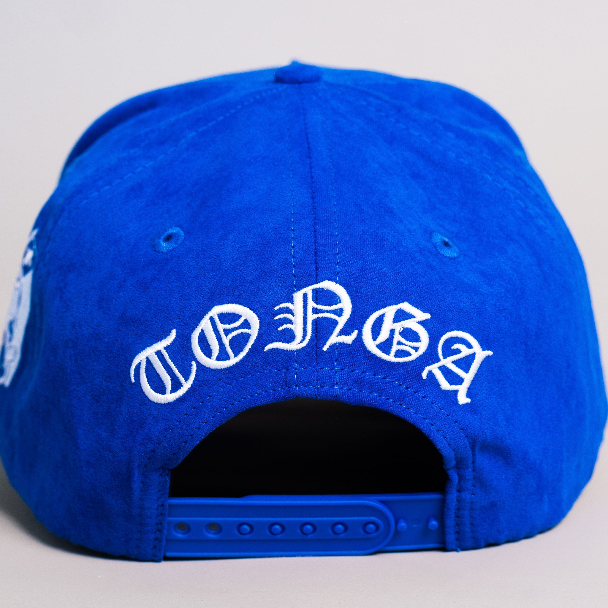 Tonga Blue Suede Snapback Hat with White T Logo and Coat of Arms Patch - Back View