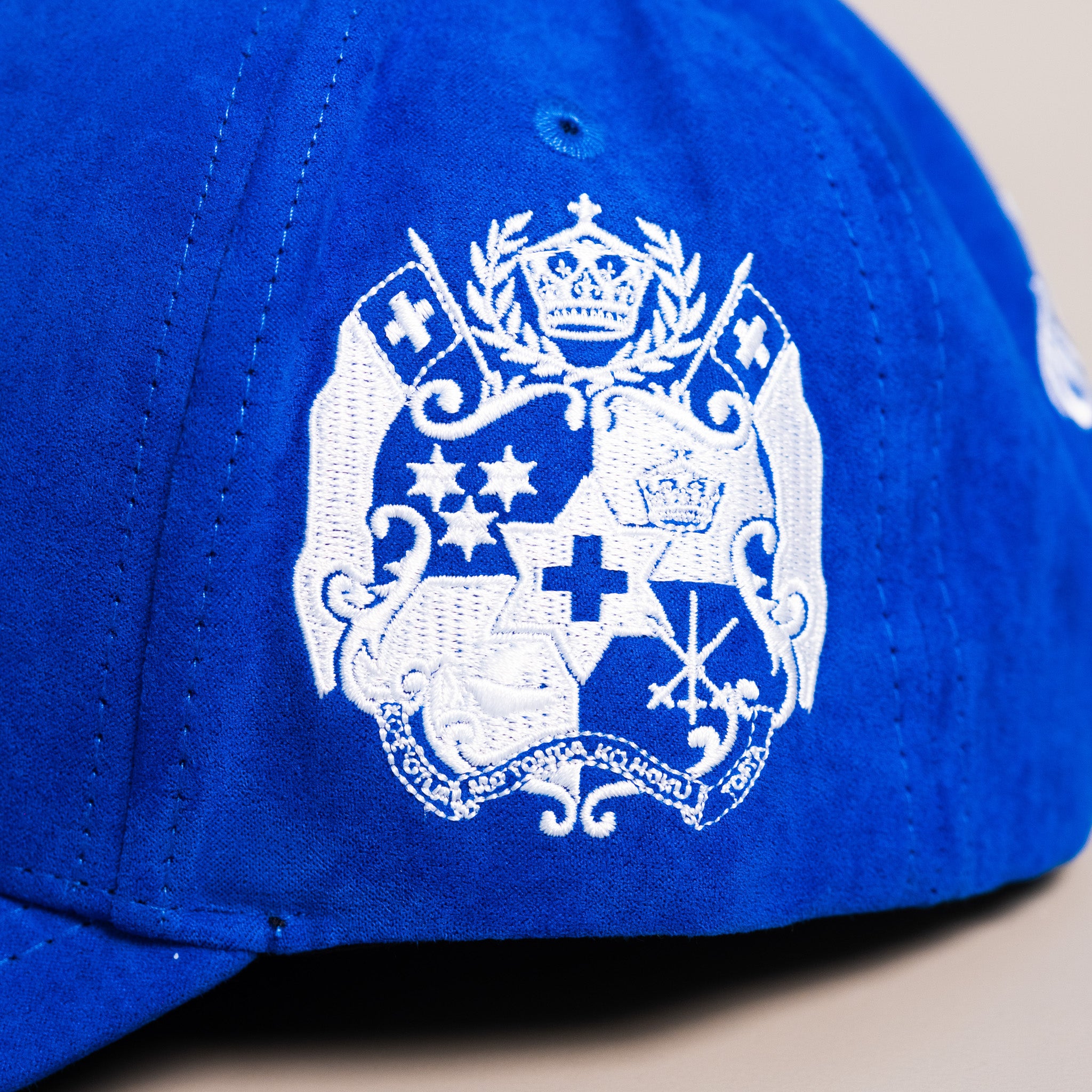 Tonga Blue Suede Snapback Hat with White T Logo and Coat of Arms Patch - Side Patch Detail