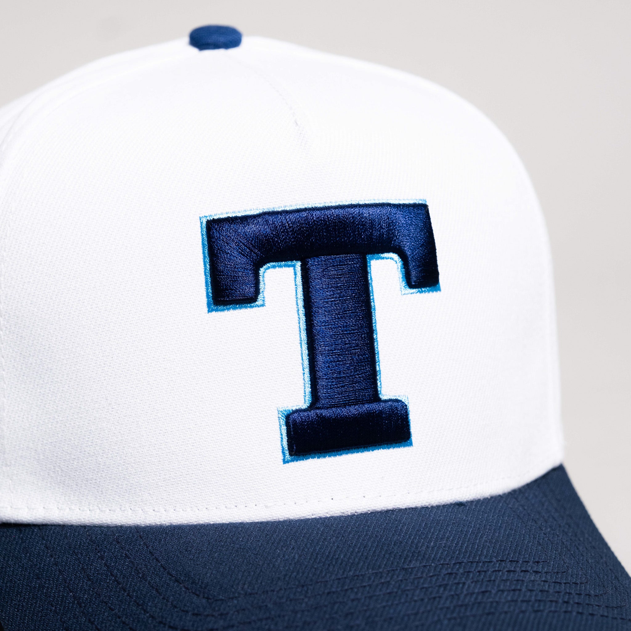 Tonga Hat White Navy Block T Snapback - Front Detail
