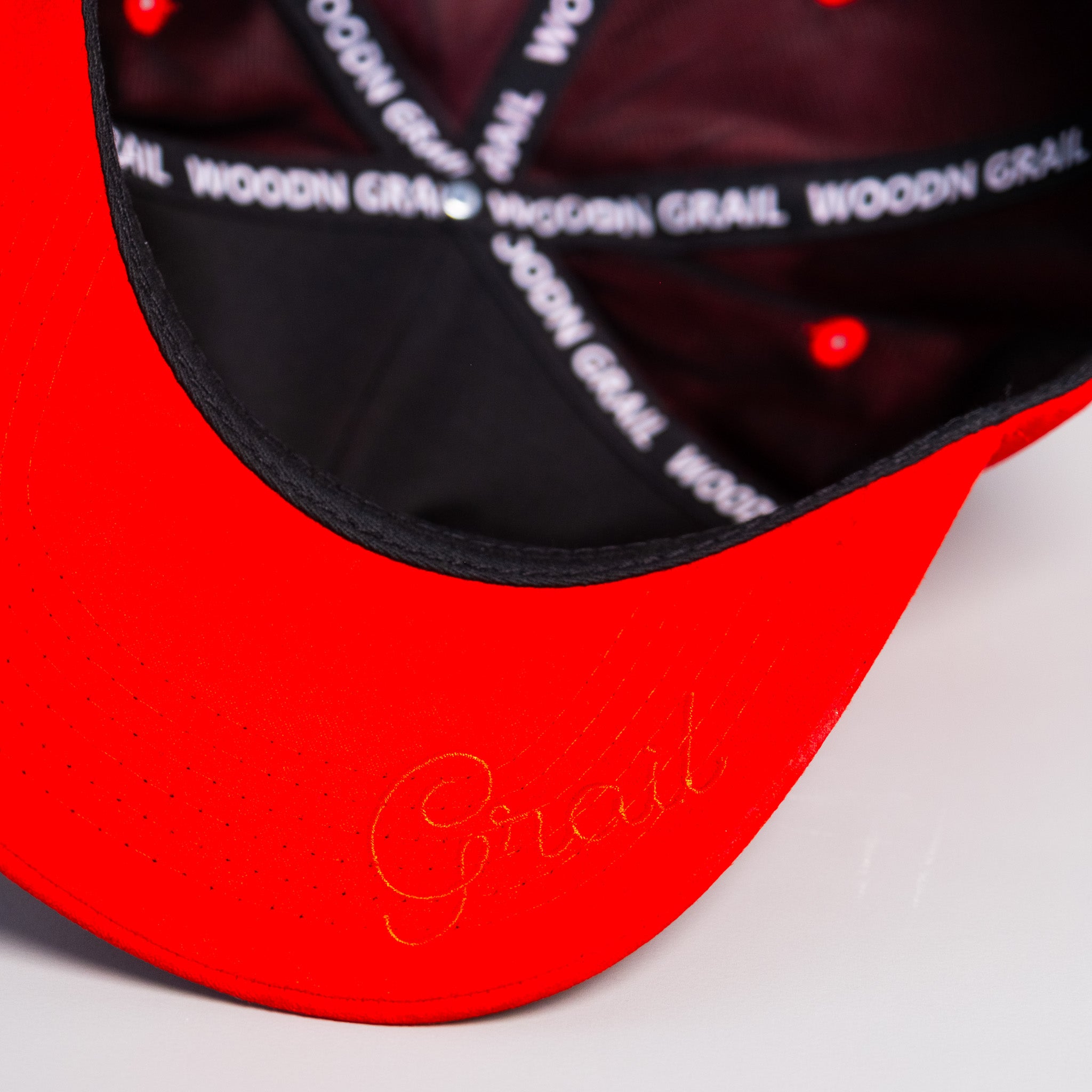 Tonga Red Suede Snapback Hat with White T Logo and Coat of Arms Patch - Underbrim Detail