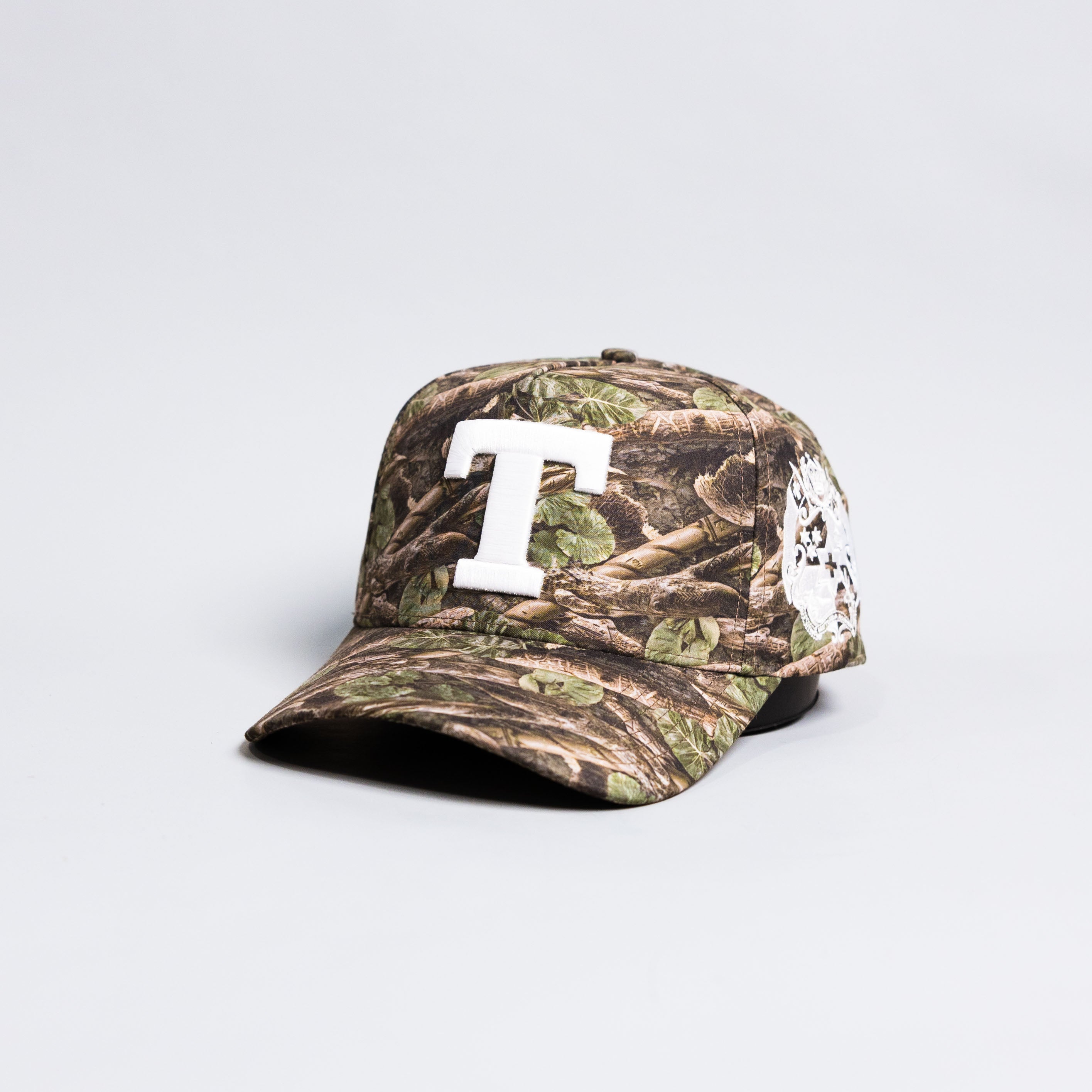 Tonga T Camo Hat Polynesian All-Camo White Logo Coat of Arms Snapback - Angled View