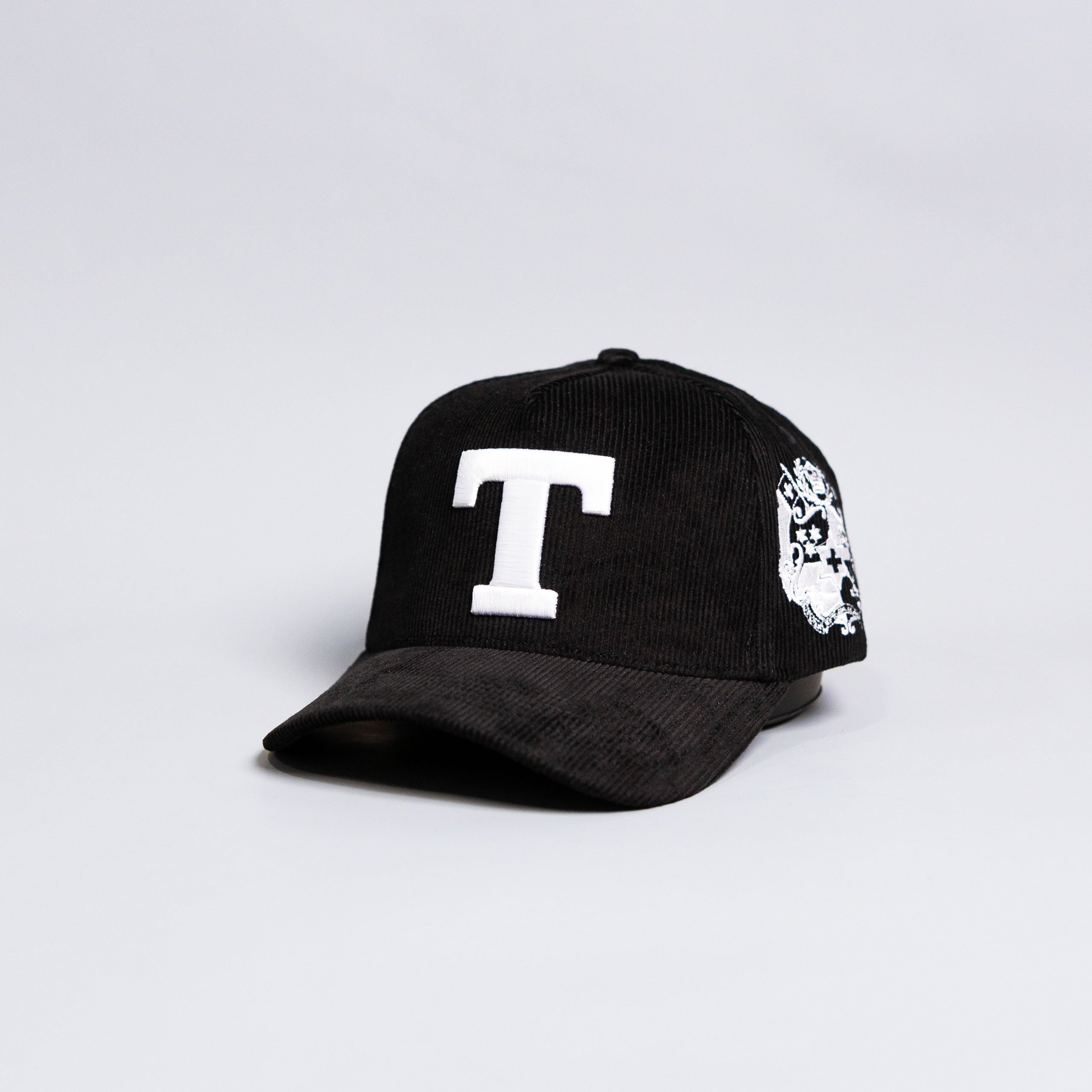 Tonga T Hat Black Corduroy Brim White Logo Coat of Arms Patch Snapback - Angled View