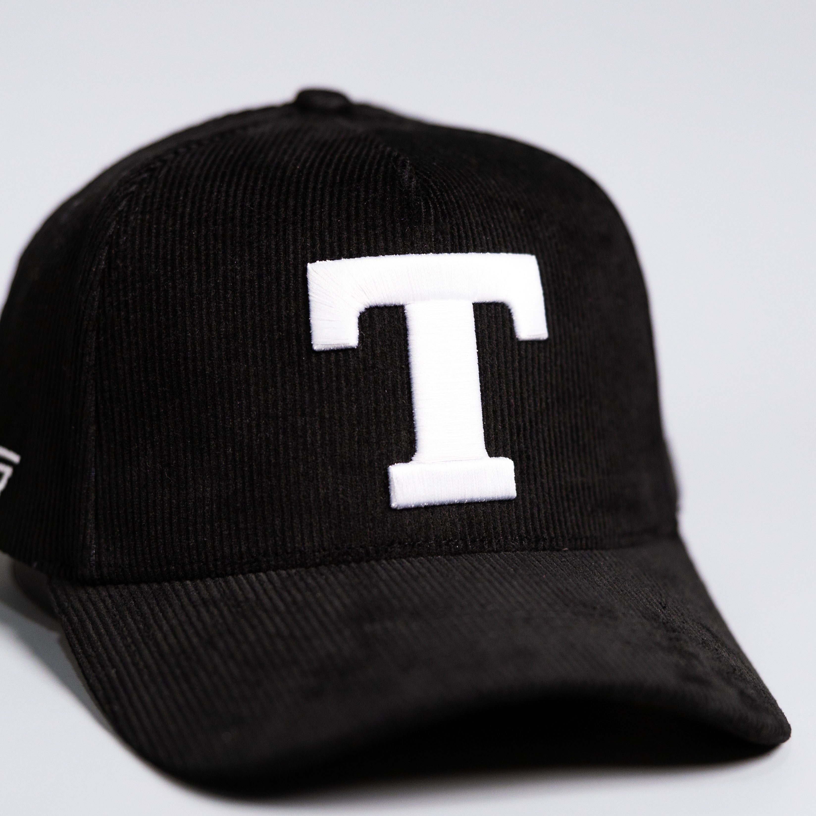 Tonga T Hat Black Corduroy Brim White Logo Coat of Arms Patch Snapback - Front Detail