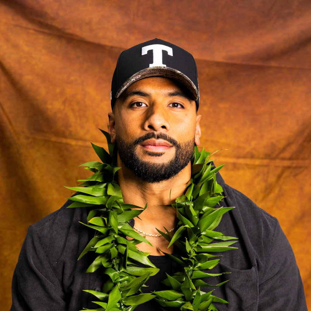 Tonga T Hat Black Polynesian Camo Brim White Logo Coat of Arms Snapback - On Model Portrait Lifestyle