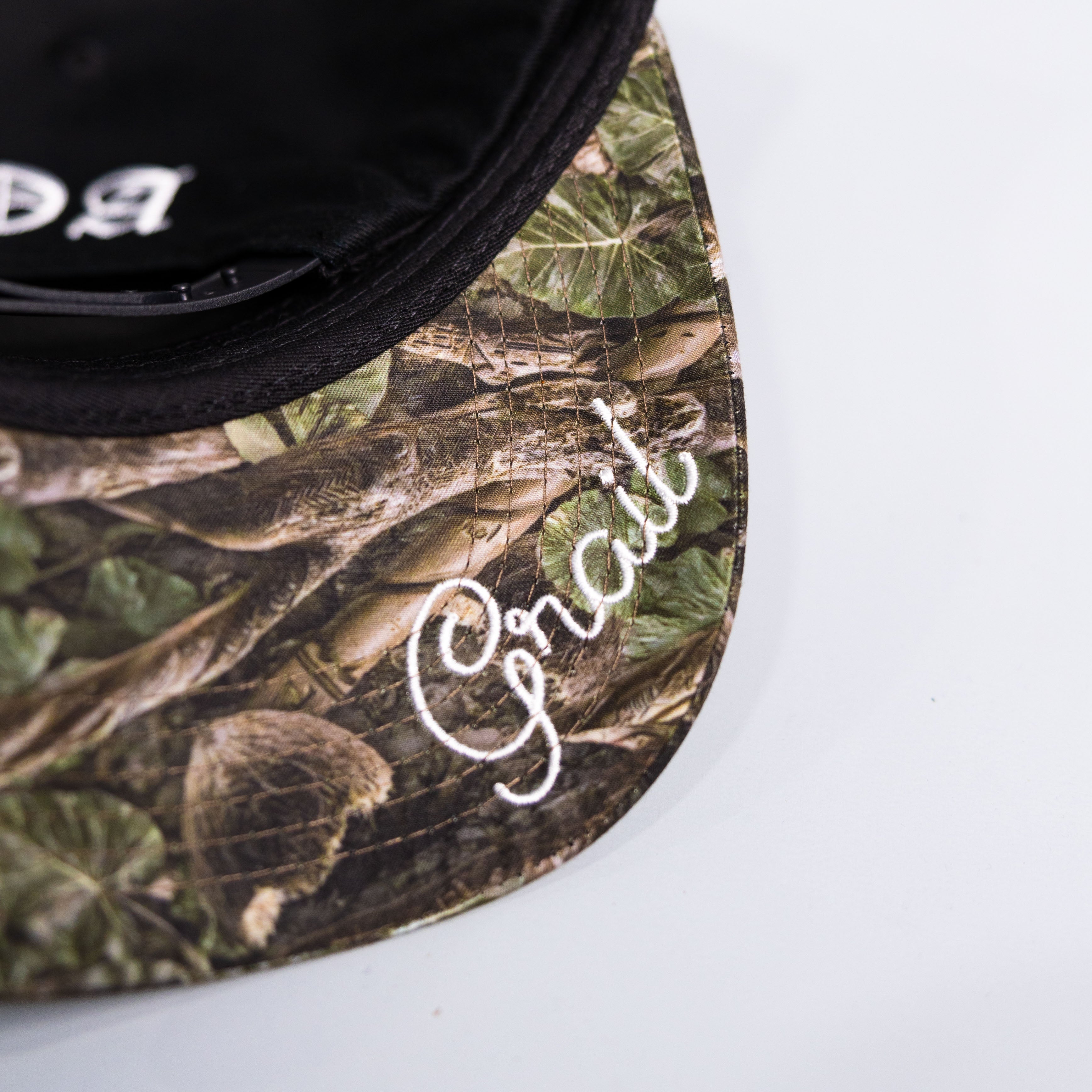 Tonga T Hat Black Polynesian Camo Brim White Logo Coat of Arms Snapback - Underbrim Detail