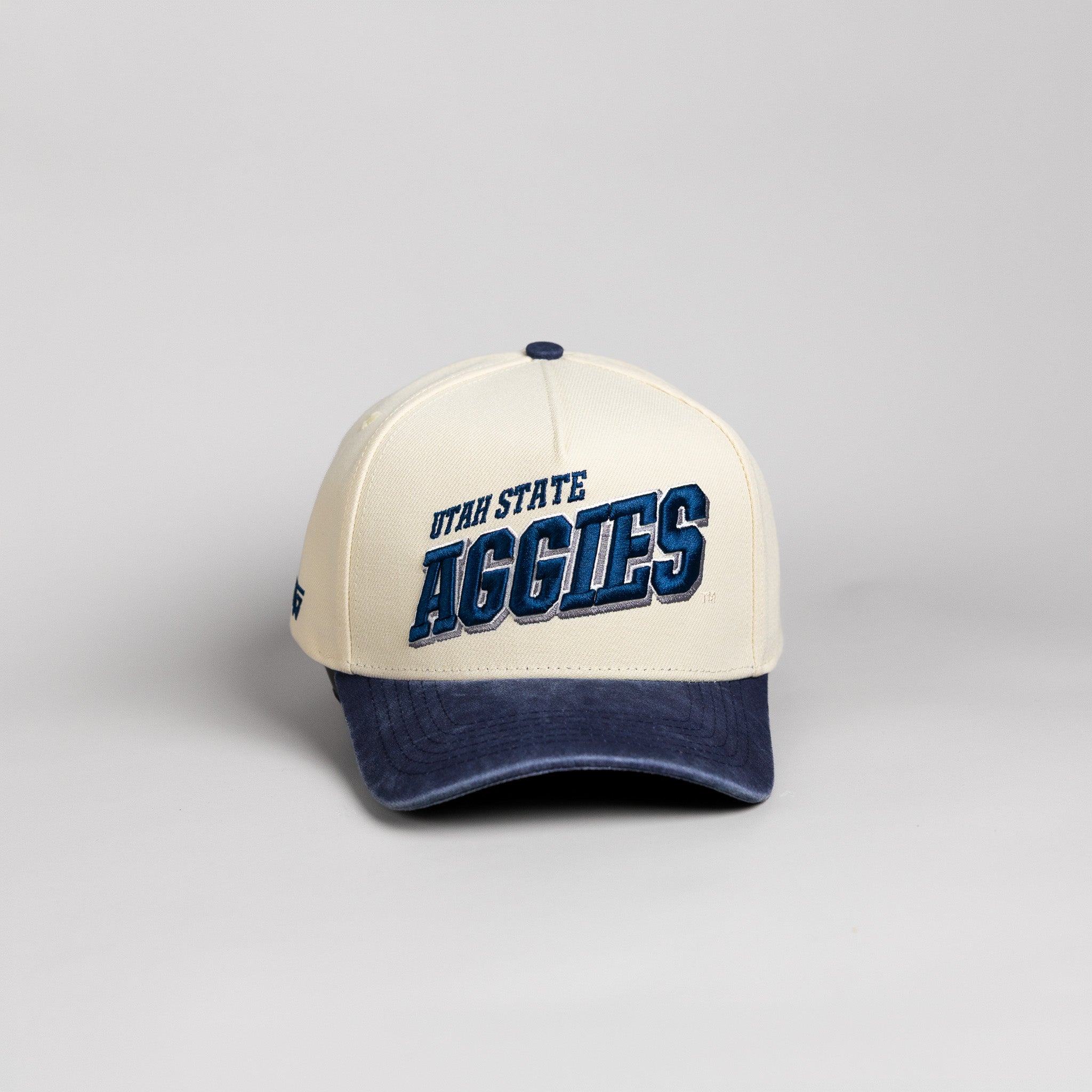 Utah State Aggies Hat Cream & Navy Tilt Snapback - Front Panel