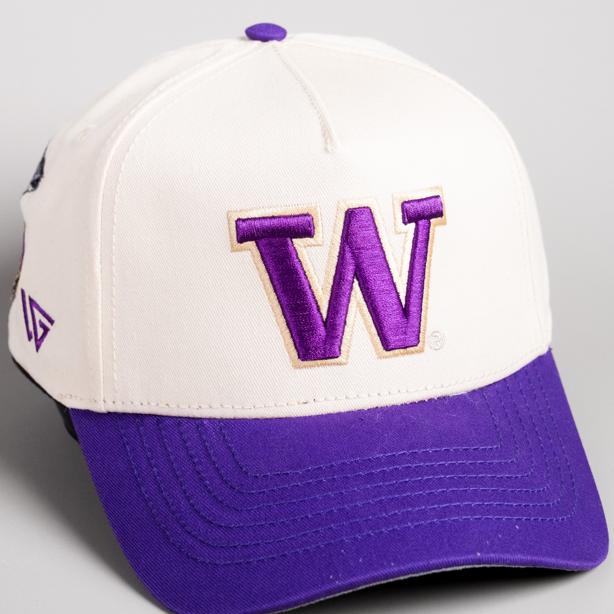 Washington Huskies Hat Cream & Purple Home Crowd Snapback - Angled View